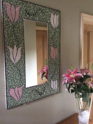 Mirror frame with tulip design